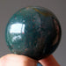 hand holding an indian bloodstone sphere