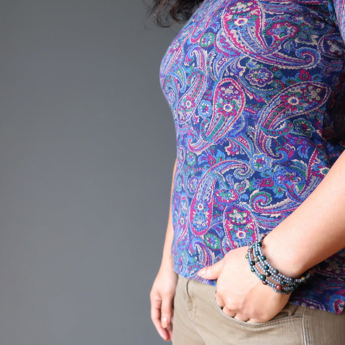 female with hand in pocket modeling bloodstone wire wrap bracelet