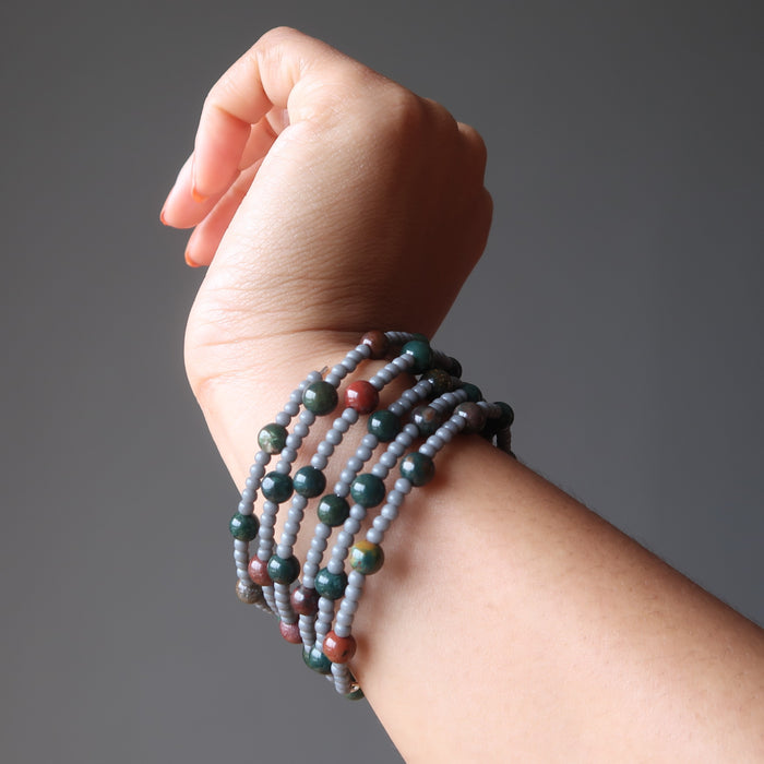 female hand modeling bloodstone wire wrap bracelet
