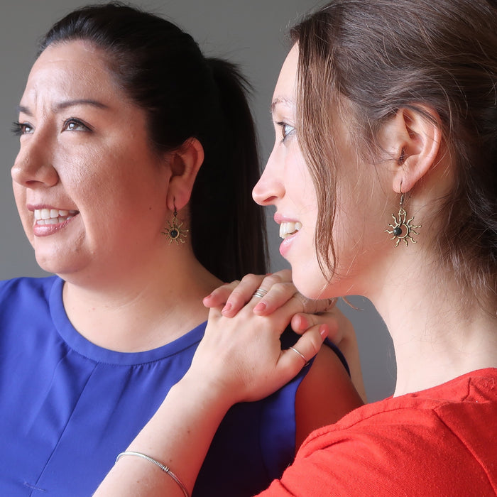 women wearing bloodstone sun earrings