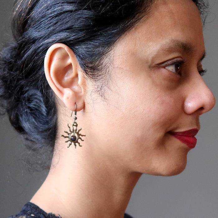 woman wearing bloodstone sun earrings