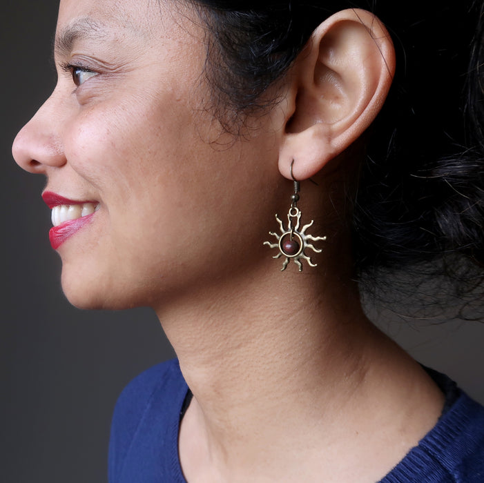 woman wearing bloodstone sun earrings