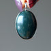 hand holding indian bloodstone pendant