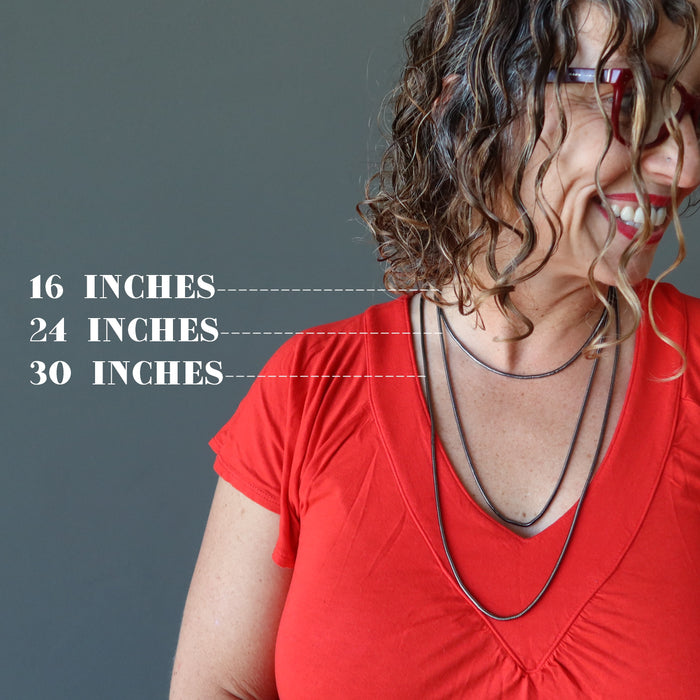 female model wearing gunmetal snake chain necklaces showing different lengths