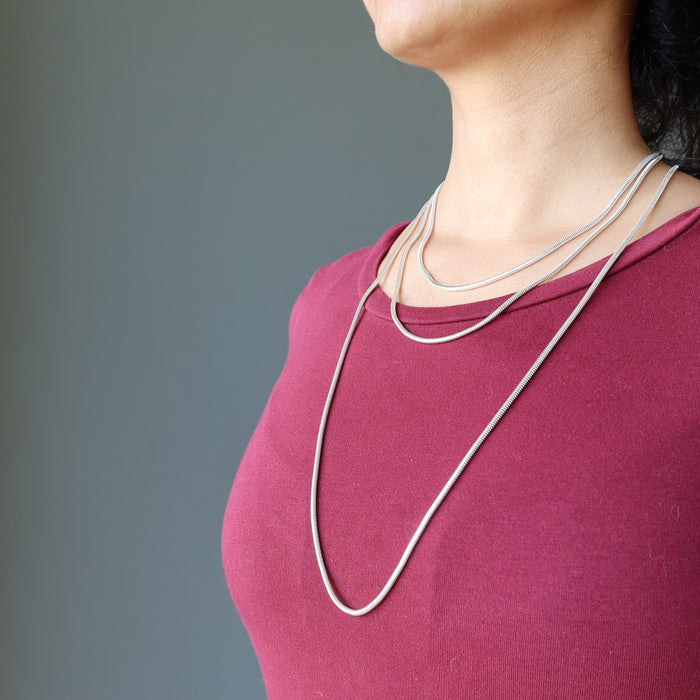 wearing different size necklaces