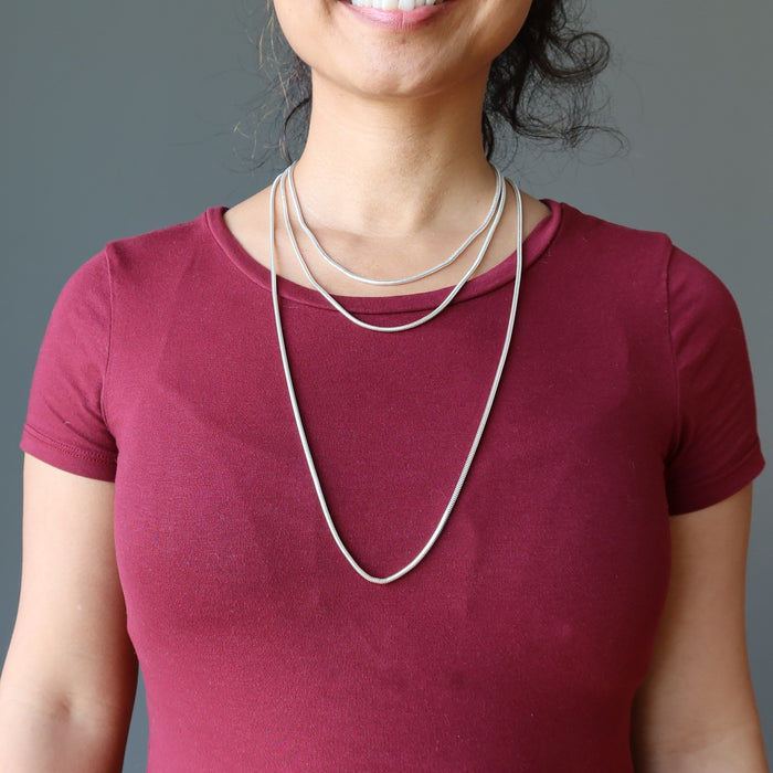 wearing different size necklaces