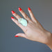green calcite ring on finger