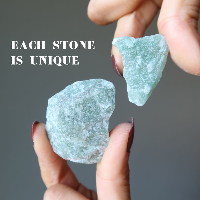 hands holding green rough calcite to show each is unique