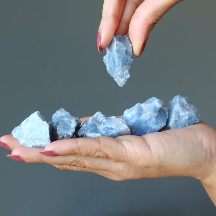 Blue Calcite Raw Gemstone Set on the palm