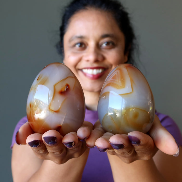 carnelian eggs in hands
