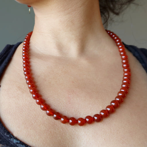 woman modeling carnelian necklace