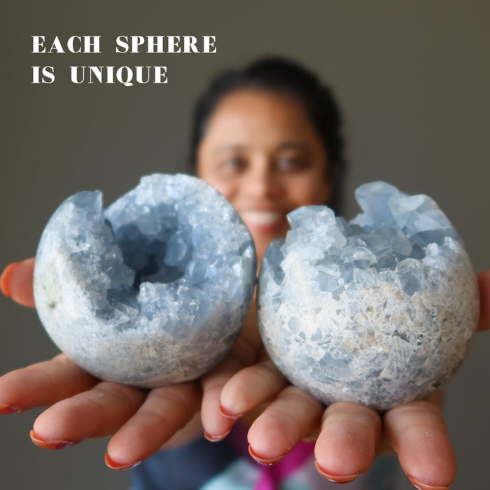 woman holding two blue celestite geode balls