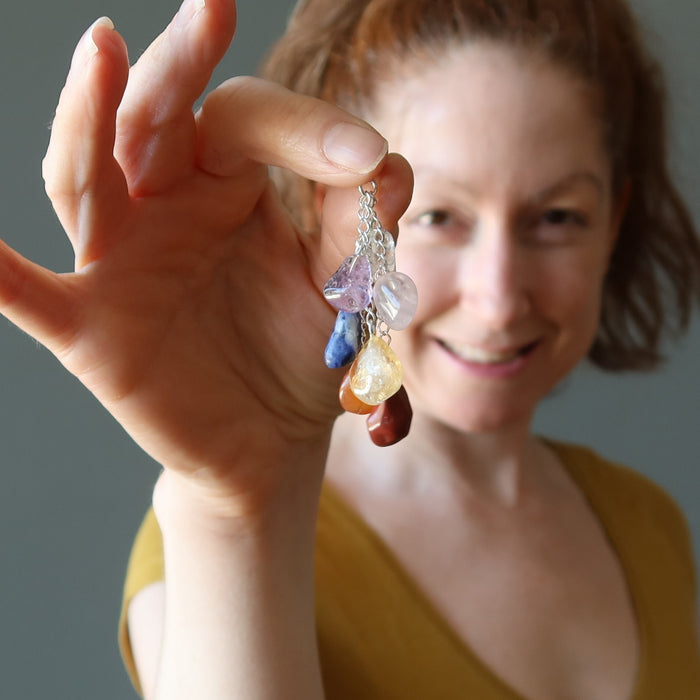 holding Dangling Chakra Rainbow tumbled Stone Pendant 