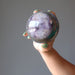 hand holding chakra sphere