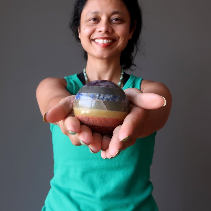 sheila of satin crystals holding out a chakra sphere