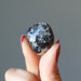 holding a Snow Quartz Chalcopyrite Tumbled Stone 