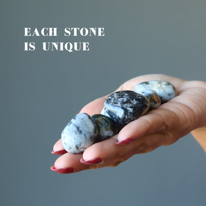 holding Snow Quartz Chalcopyrite Tumbled Stone Set showing each stone is unique