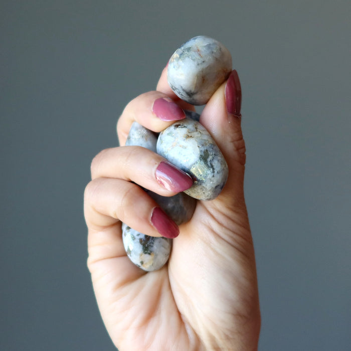 holding Snow Quartz Chalcopyrite Tumbled Stone Set