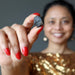 sheila of satin crystals holding rocky brown chelyabinsk meteorite 