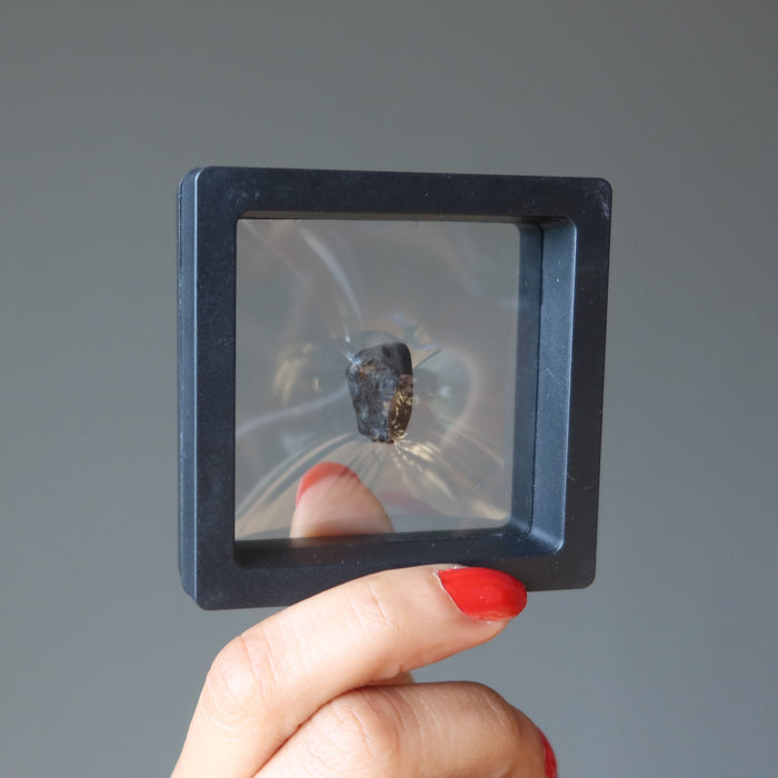 rocky brown chelyabinsk meteorite in secure zero gravity case