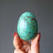 hand holding chrysocolla egg