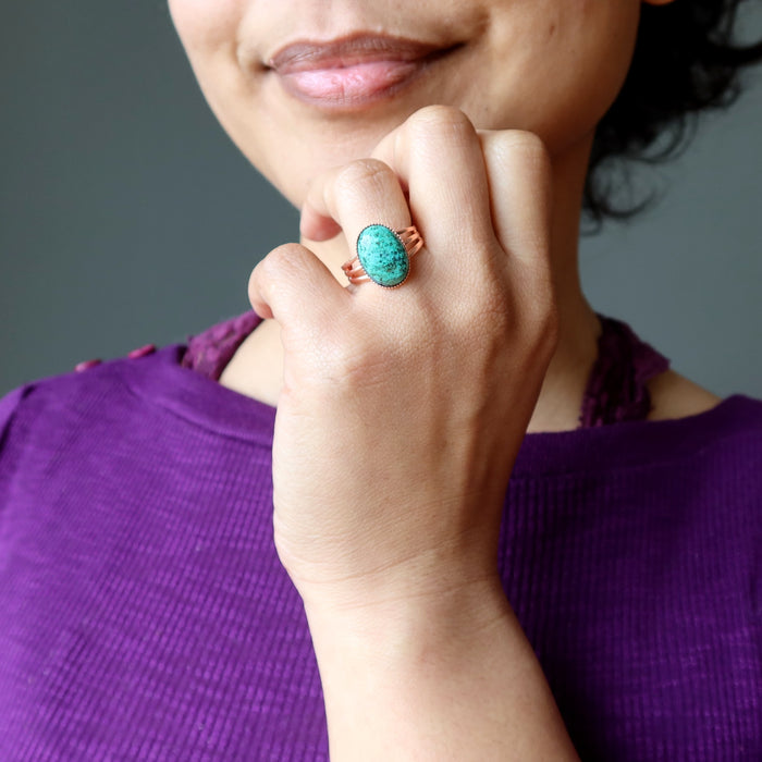 hand wearing chrysocolla copper ring
