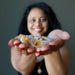 sheila of satin crystals holding raw citrine point