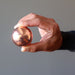 hand holding a copper alchemist sphere