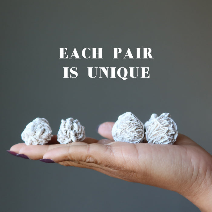 holding 4 Selenite Desert Roses each is unique