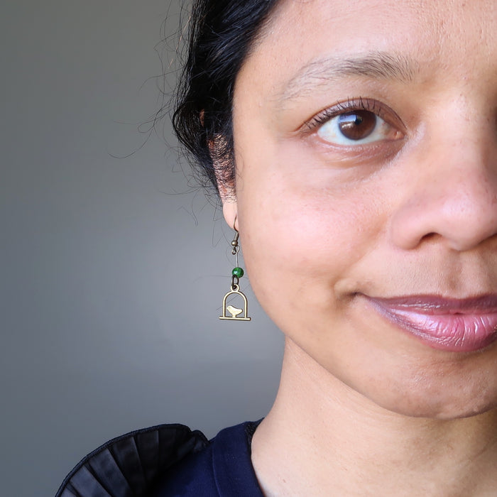 sheila of satin crystals wearing green diopside on birdcage dangle earrings