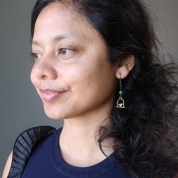 sheila of satin crystals wearing green diopside on birdcage dangle earrings