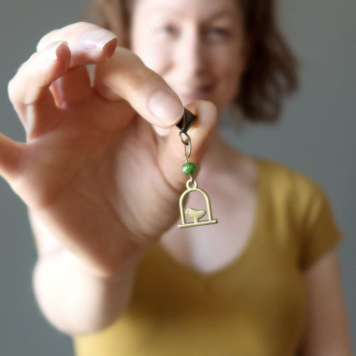 model holding Swinging Bird green Diopside Pendant
