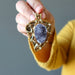model holding 2.6 x 1.8 inches oval Druzy Amethyst Gold Leaf framed Pendant 
