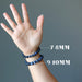 model wearing 7-8mm and 9-10mm round beaded Dumortierite Bracelet