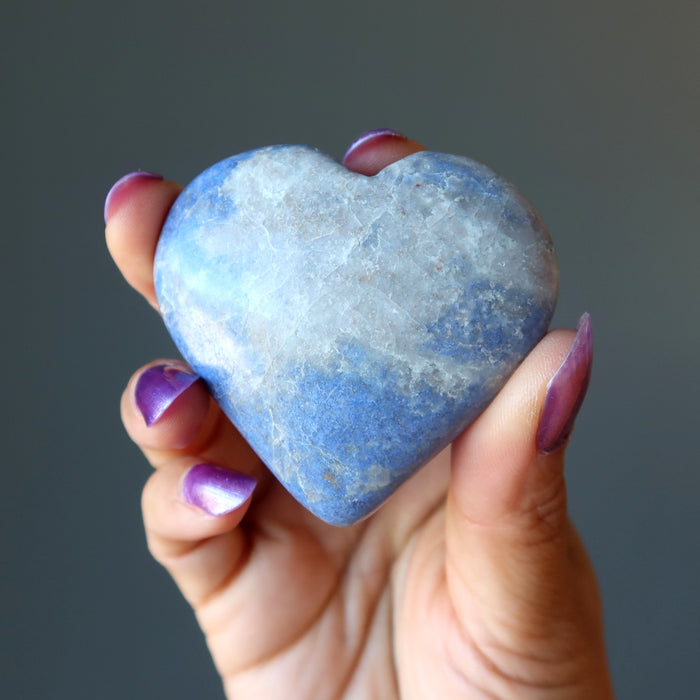 hand holding dumortierite crystal heart