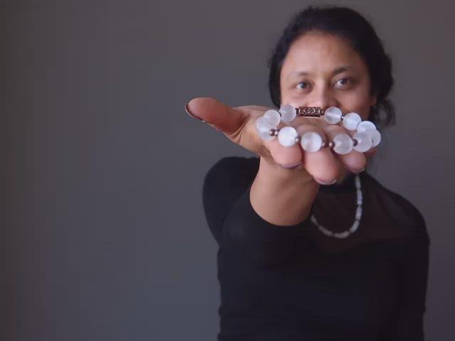 video on white selenite and antique beads stretch bracelet