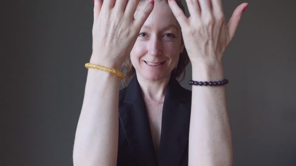 video of female model showcasing citrine and amethyst bracelet set