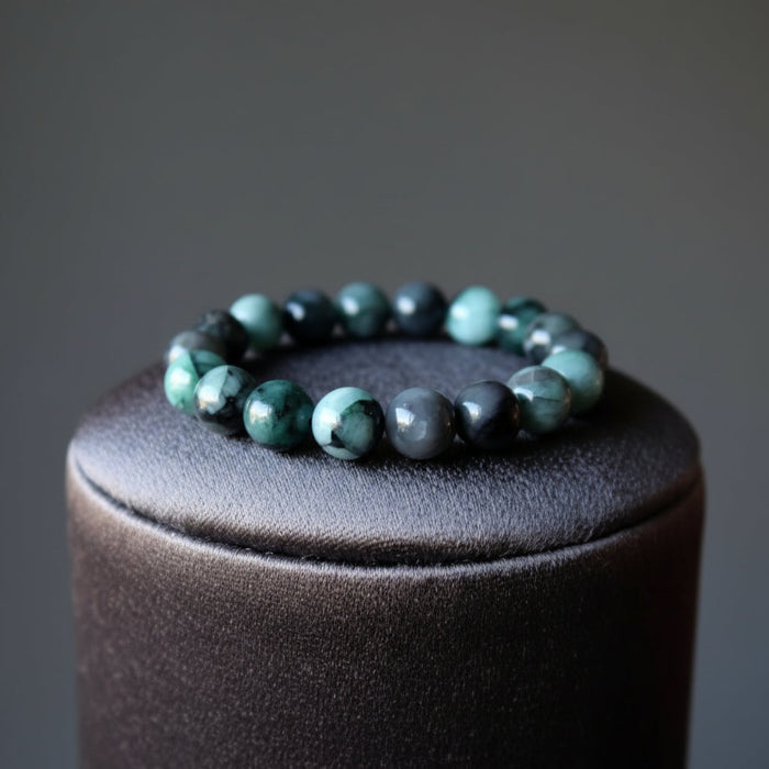 emerald stretch bracelet on black pillow