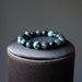 emerald stretch bracelet on black pillow