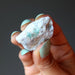 hand holding raw Emerald Cluster