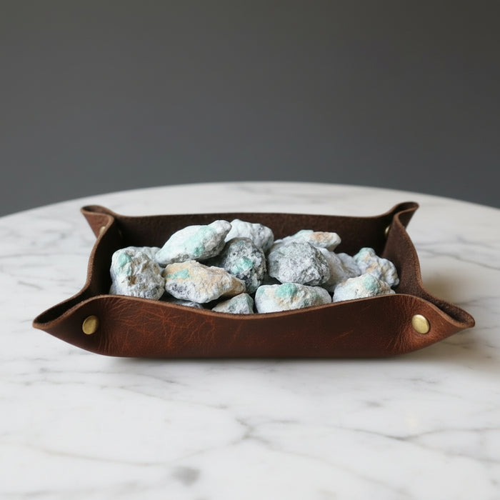 many raw Emerald Clusters on the palm