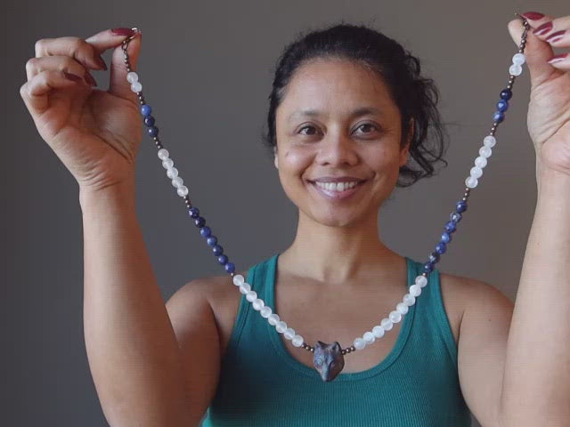 video featuring wolf necklace