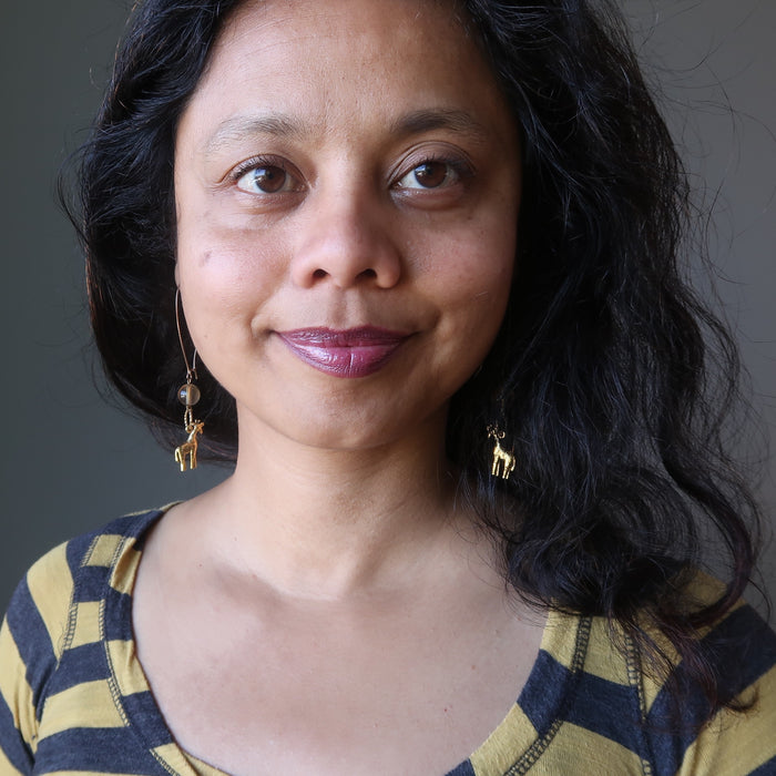 woman modeling fluorite giraffee earrings