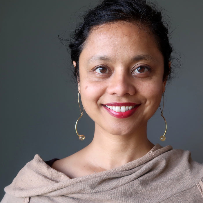 sheila of satin crystals wearing golden fluorite earrings