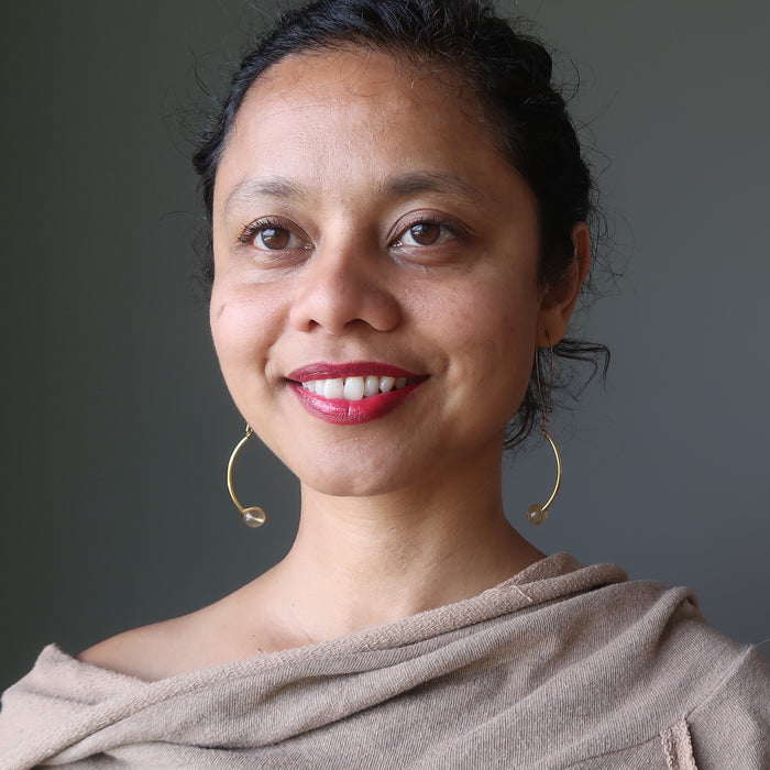 sheila of satin crystals wearing golden fluorite earrings