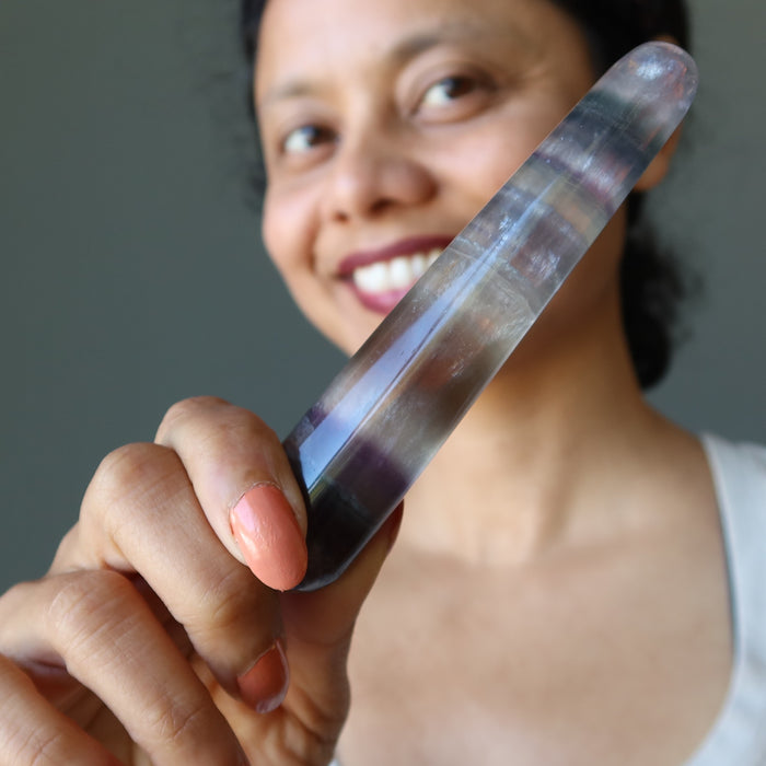 sheila of satin crystals holding rainbow fluorite tapered massage wand