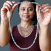 sheila of satin crystals holding Beaded Rainbow Fluorite Necklace