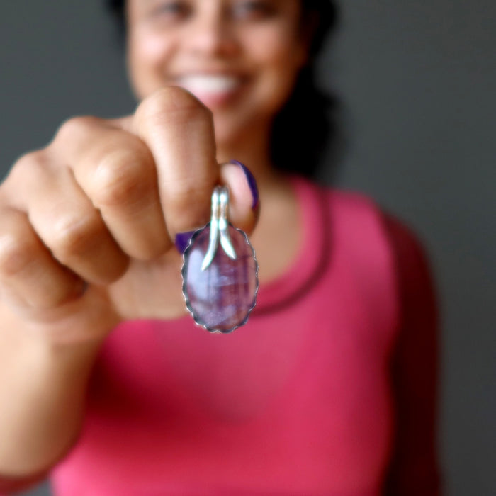 sheila of satin crystals holding Sterling Silver Rainbow Fluorite Pendant 