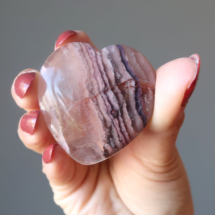 hand holding a Fluorite Heart