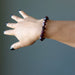 hand wearing a Faceted Garnet Bracelet